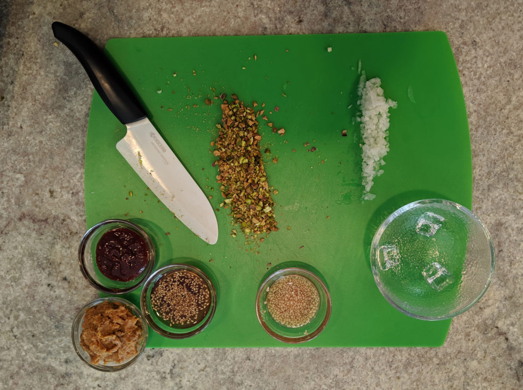 Ssamjang sauce ingredients on a green cutting board