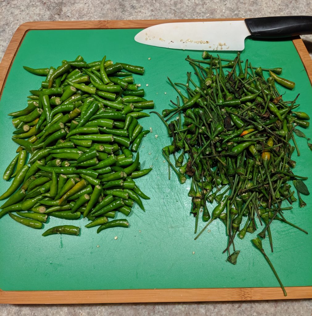 thai chili peppers with their tops removed for a thai chili hot sauce