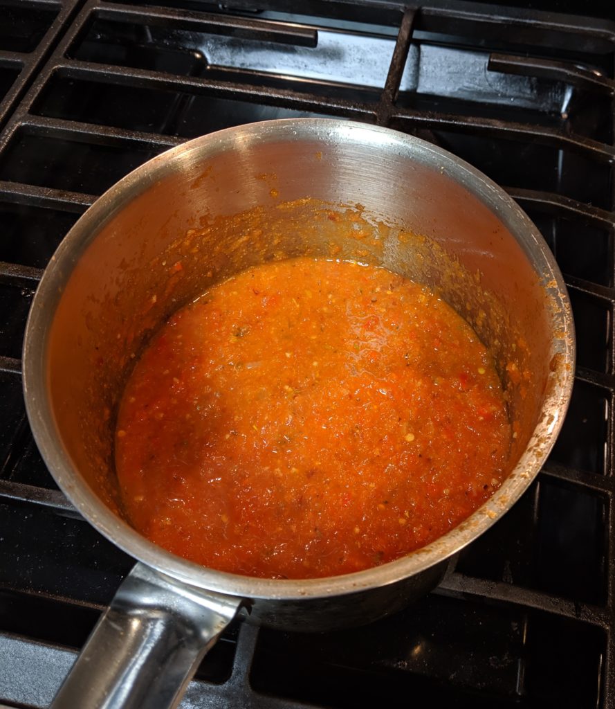 Spicy cream Diavolo sauce on stove