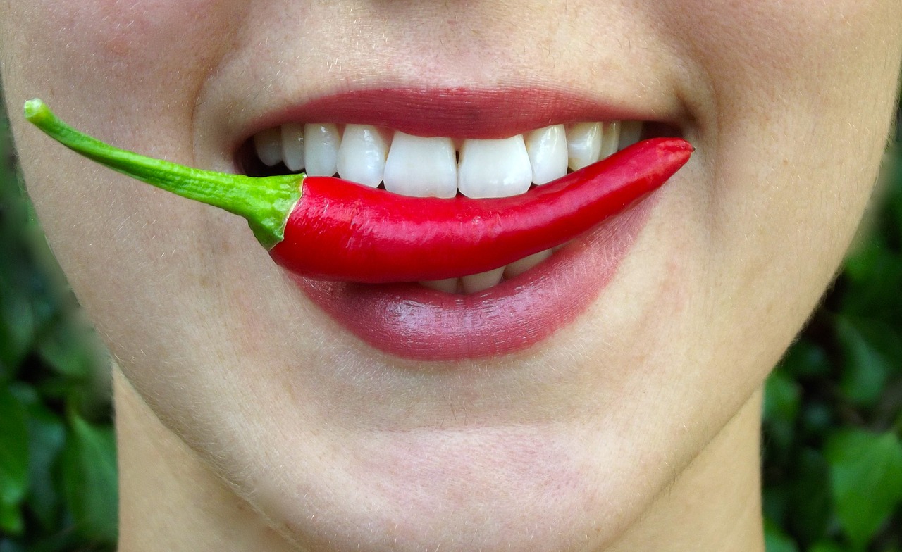 lady smiling with a pepper