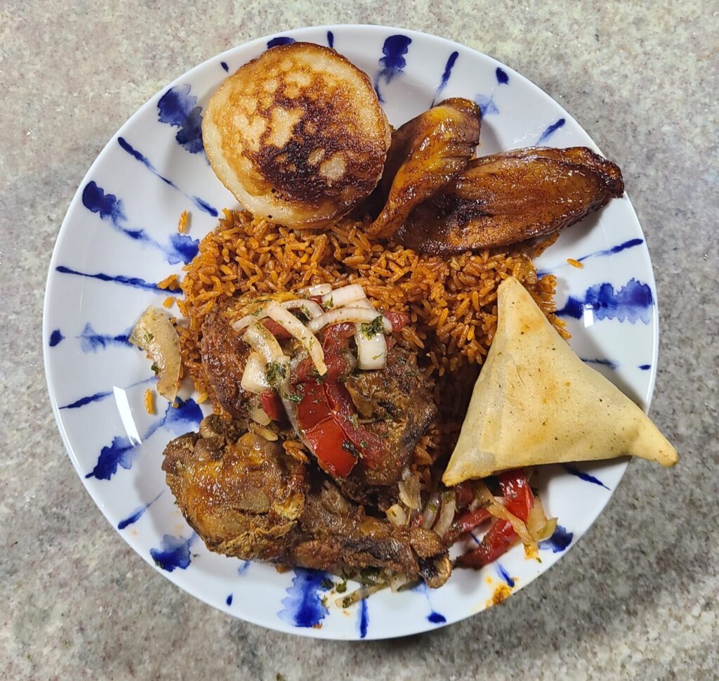 jollof rice with chicken at drelyse by fartley farms