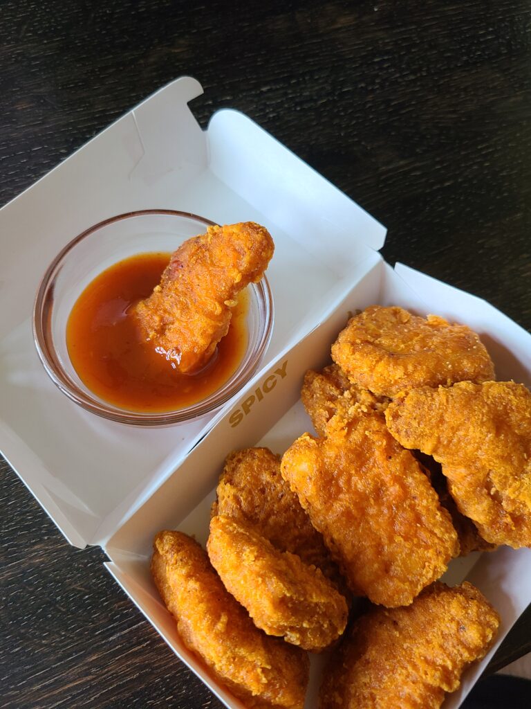 dipped mcnugget in mighty hot sauce