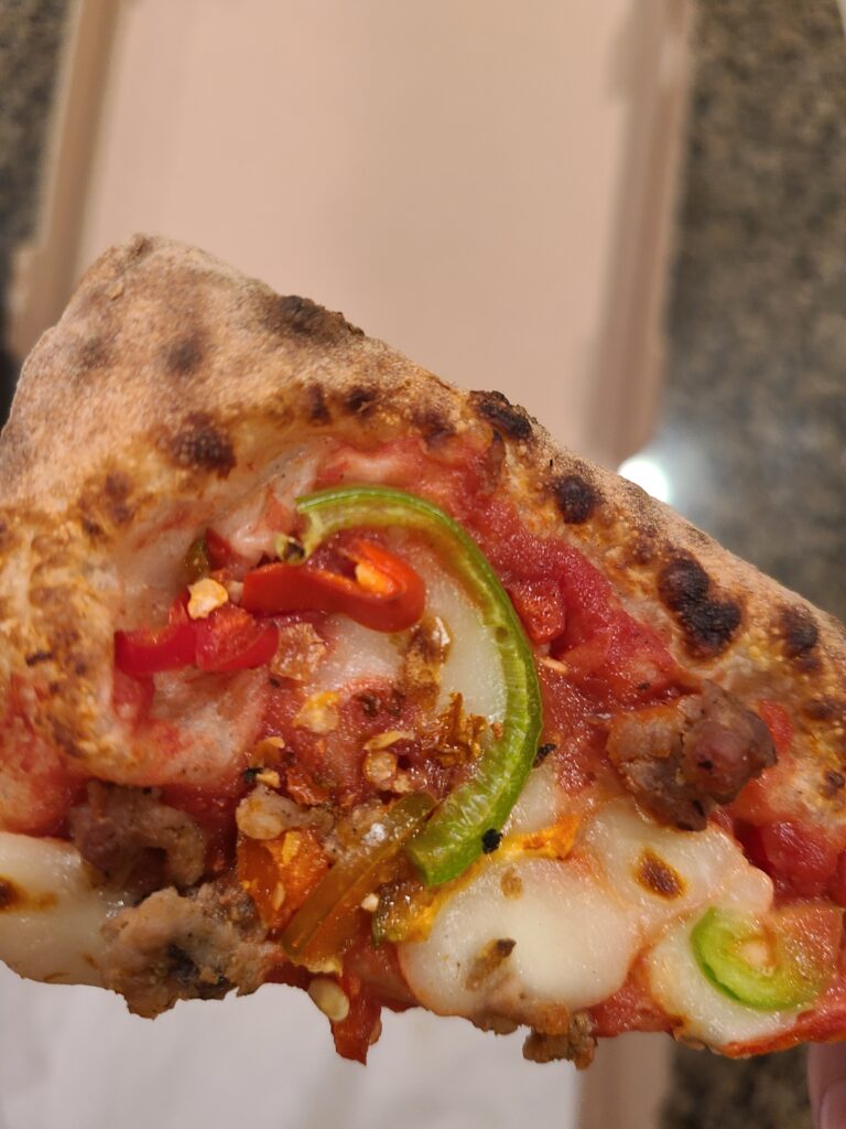 close up of goremade 4 alarm pizza