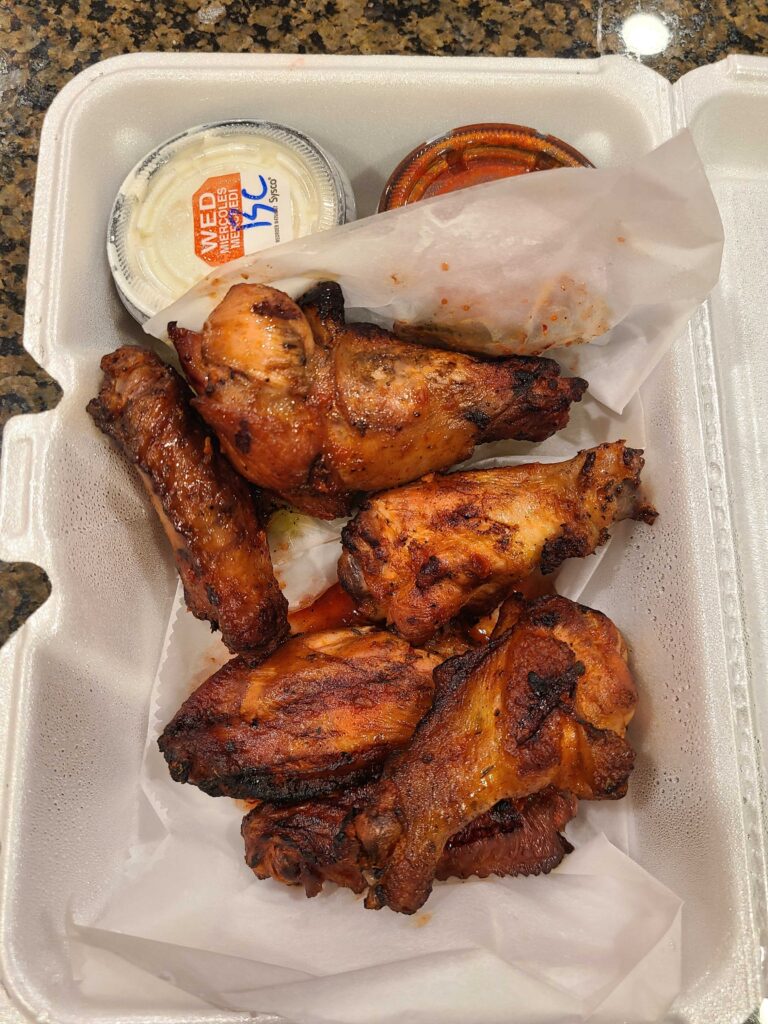 smokehouse brewing wings with lucifer sauce